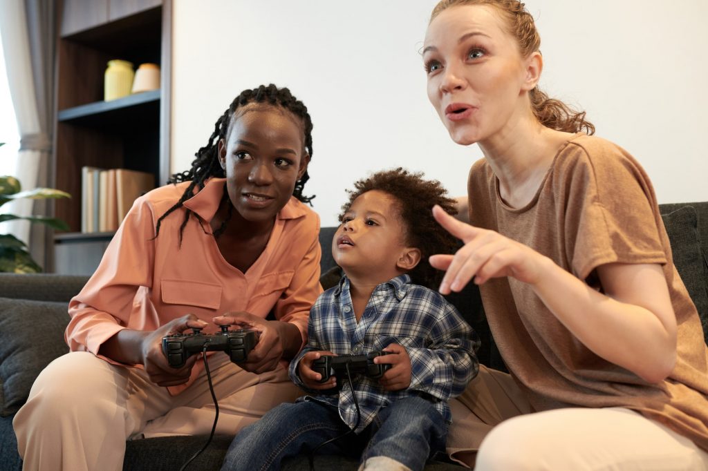 Diverse Parents and Son Playing Video Game